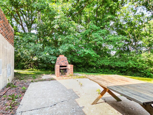 4705 Roemer Rd, Columbia, MO 65202 - view of patio / terrace with an outdoor brick fireplace