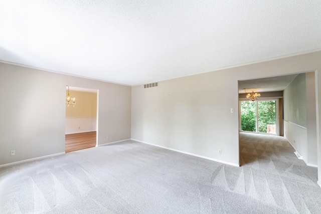 4705 Roemer Rd, Columbia, MO 65202 - unfurnished room with a chandelier, light carpet, crown molding, and a textured ceiling