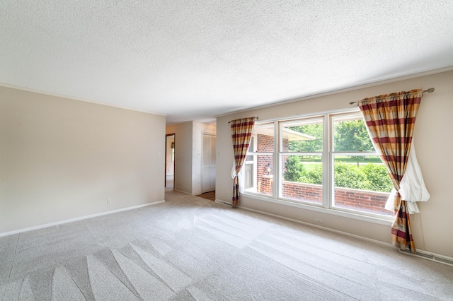 4705 Roemer Rd, Columbia, MO 65202 - spare room featuring a textured ceiling and carpet floors