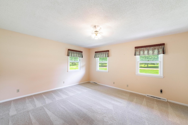 4705 Roemer Rd, Columbia, MO 65202 - unfurnished room with light colored carpet and a textured ceiling