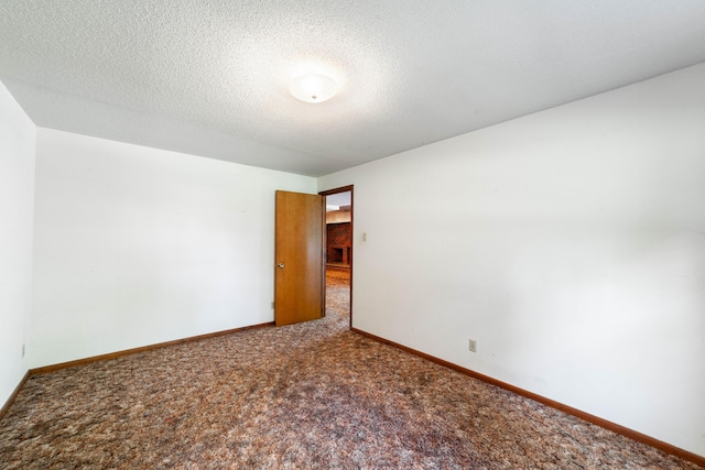 4705 Roemer Rd, Columbia, MO 65202 - empty room with carpet and a textured ceiling