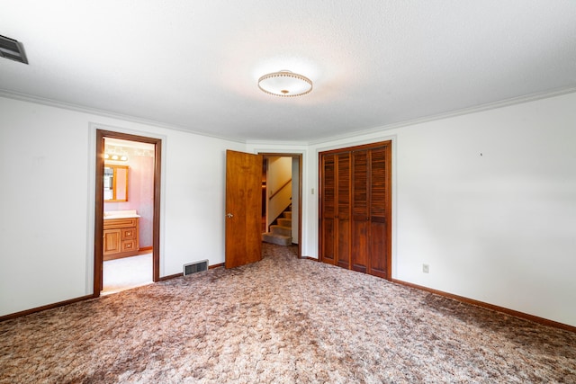 4705 Roemer Rd, Columbia, MO 65202 - unfurnished bedroom with a closet, crown molding, light carpet, and connected bathroom