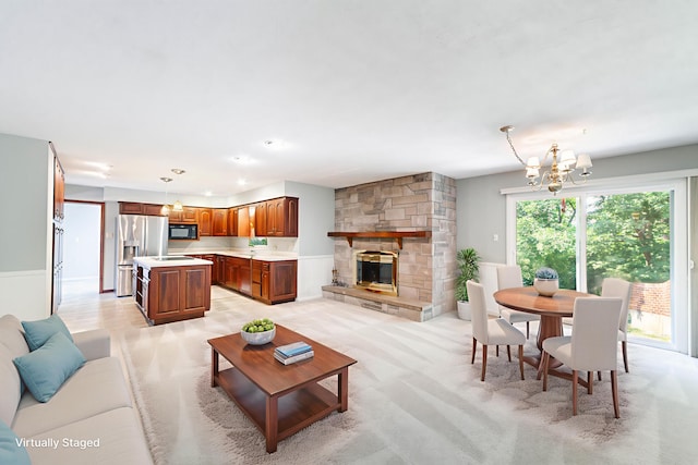 4705 Roemer Rd, Columbia, MO 65202 - living area featuring a chandelier and a stone fireplace