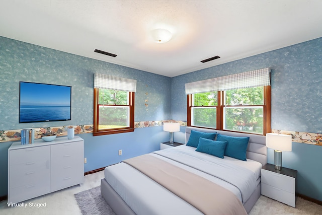 4705 Roemer Rd, Columbia, MO 65202 - bedroom featuring wallpapered walls, multiple windows, and carpet flooring