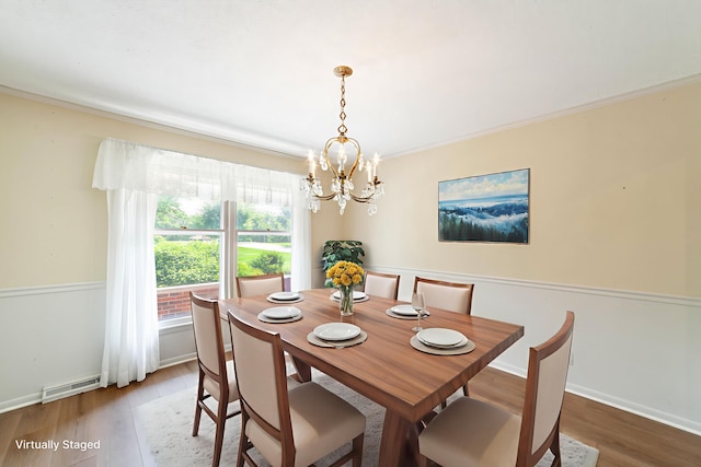 4705 Roemer Rd, Columbia, MO 65202 - dining space with a chandelier, wood finished floors, and crown molding