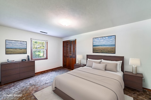 4705 Roemer Rd, Columbia, MO 65202 - bedroom featuring dark colored carpet and a closet