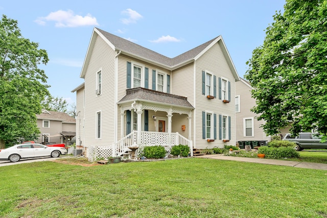 801 Court St, Fulton, MO 65251 - view of front of home featuring a front yard, covered porch, and a shingled roof