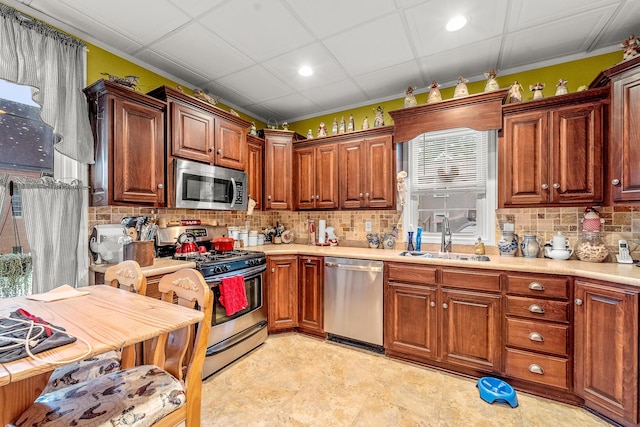 801 Court St, Fulton, MO 65251 - kitchen with stainless steel appliances, light countertops, recessed lighting, backsplash, and brown cabinets