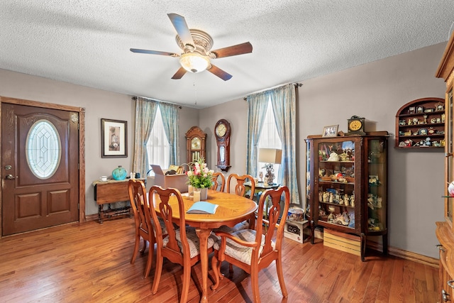 801 Court St, Fulton, MO 65251 - dining space featuring plenty of natural light, light wood-type flooring, ceiling fan, and a textured ceiling