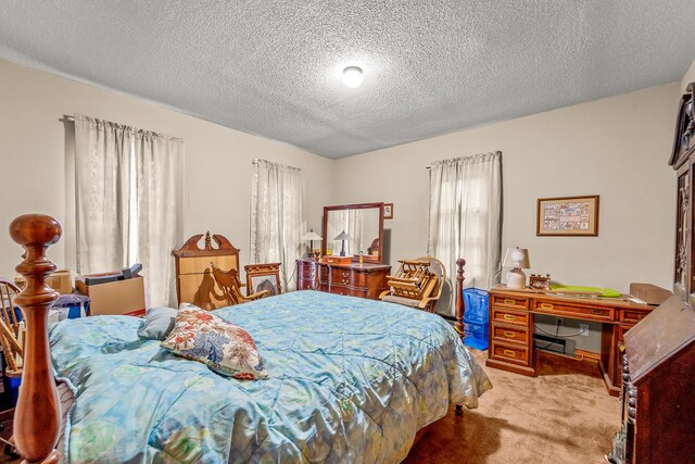 801 Court St, Fulton, MO 65251 - bedroom with light colored carpet, a textured ceiling, and a desk