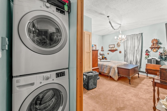 801 Court St, Fulton, MO 65251 - laundry area with estacked washer and dryer, light colored carpet, a chandelier, and a textured ceiling