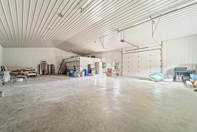 4604 County Road 115, Fulton, MO 65251 - garage featuring metal wall and a garage door opener