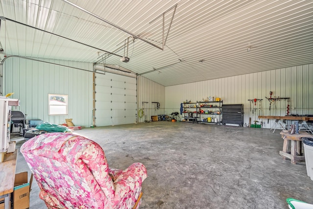 4604 County Road 115, Fulton, MO 65251 - garage with metal wall and a garage door opener