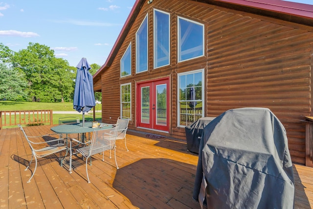 4604 County Road 115, Fulton, MO 65251 - wooden deck featuring french doors, outdoor dining area, a lawn, and a grill