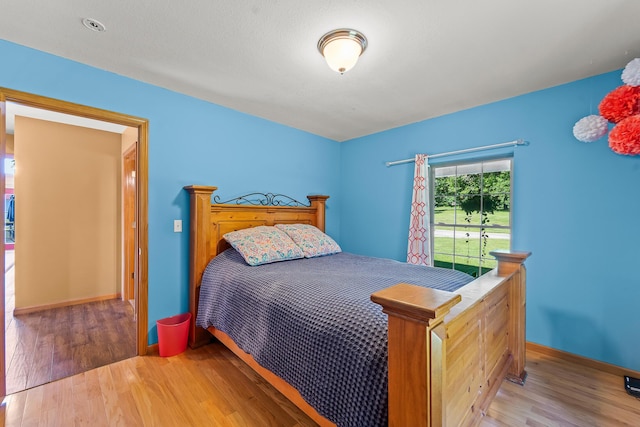 4604 County Road 115, Fulton, MO 65251 - bedroom with wood finished floors and baseboards