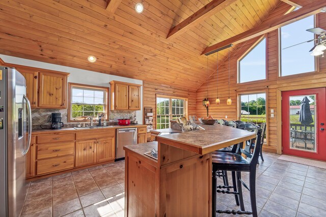 4604 County Road 115, Fulton, MO 65251 - kitchen featuring stainless steel appliances, a center island, plenty of natural light, wood ceiling, and a kitchen bar