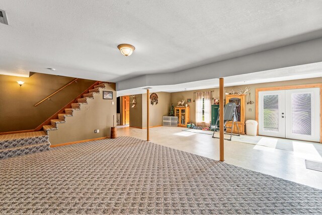 4604 County Road 115, Fulton, MO 65251 - below grade area featuring stairs, a textured ceiling, french doors, and tile patterned floors