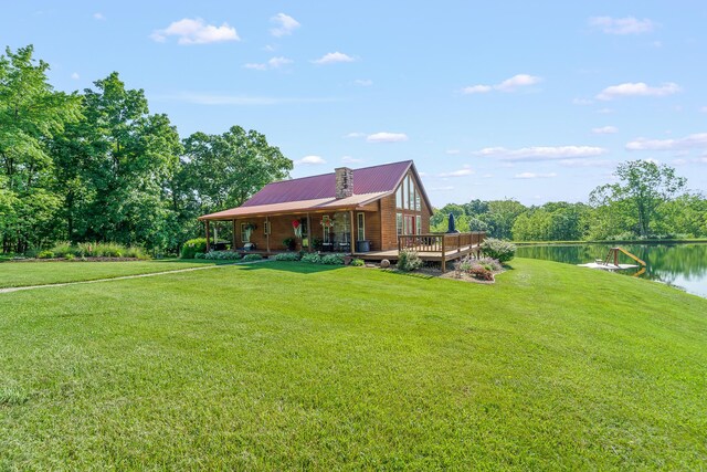 4604 County Road 115, Fulton, MO 65251 - rear view of house with a yard, a water view, and a metal roof