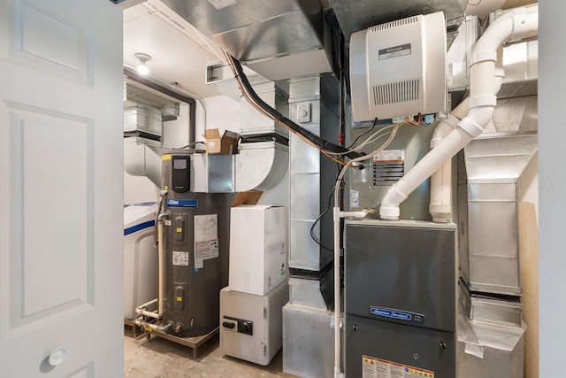 9050 Hartley Rd, Hallsville, MO 65255 - utility room featuring heat pump water heater