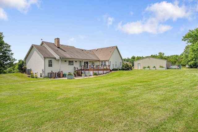 9050 Hartley Rd, Hallsville, MO 65255 - back of property with a chimney, a yard, and a wooden deck