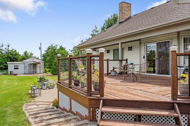 9050 Hartley Rd, Hallsville, MO 65255 - deck featuring a yard and an outbuilding