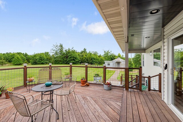 9050 Hartley Rd, Hallsville, MO 65255 - deck featuring a lawn and view of scattered trees