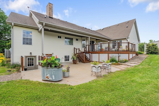 9050 Hartley Rd, Hallsville, MO 65255 - rear view of property with stairway, a patio, a deck, a lawn, and a chimney