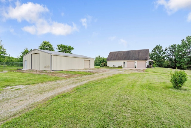 9050 Hartley Rd, Hallsville, MO 65255 - view of yard with a detached garage, an outdoor structure, a pole building, and driveway