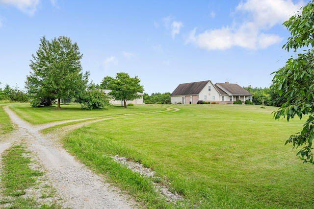9050 Hartley Rd, Hallsville, MO 65255 - view of green lawn with driveway