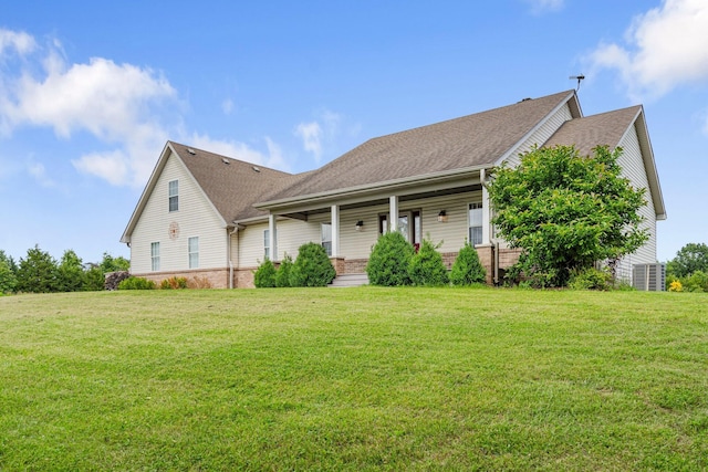 9050 Hartley Rd, Hallsville, MO 65255 - view of front of home featuring a front lawn, covered porch, roof with shingles, and brick siding
