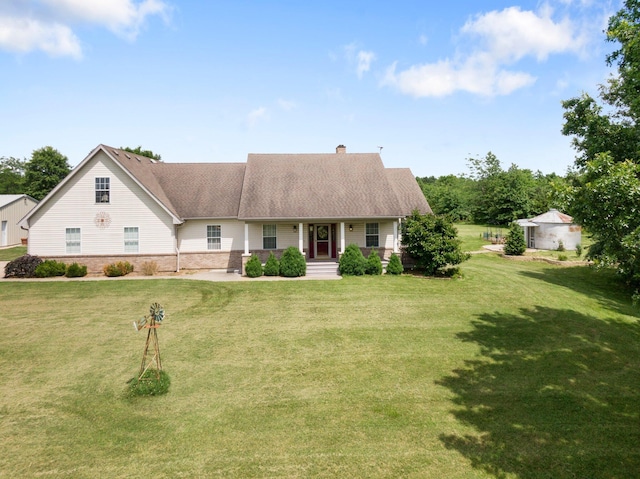 9050 Hartley Rd, Hallsville, MO 65255 - view of front facade with a porch, a chimney, and a front lawn