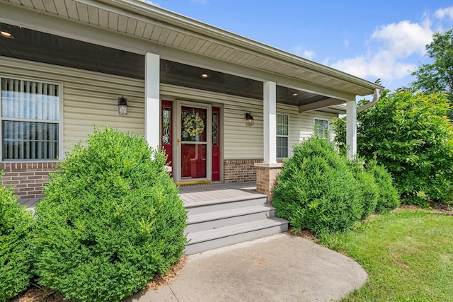 9050 Hartley Rd, Hallsville, MO 65255 - view of exterior entry with brick siding and a porch