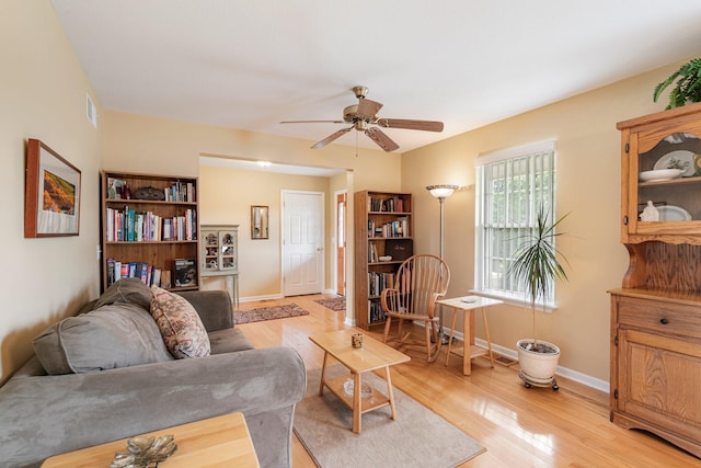 9050 Hartley Rd, Hallsville, MO 65255 - living area with light wood-type flooring and ceiling fan