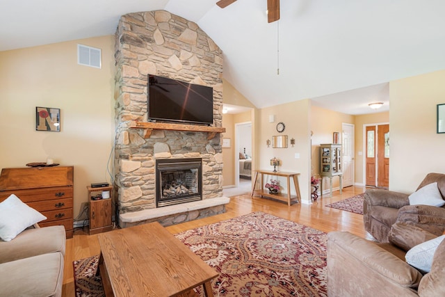 9050 Hartley Rd, Hallsville, MO 65255 - living room with a fireplace, a ceiling fan, wood finished floors, and high vaulted ceiling