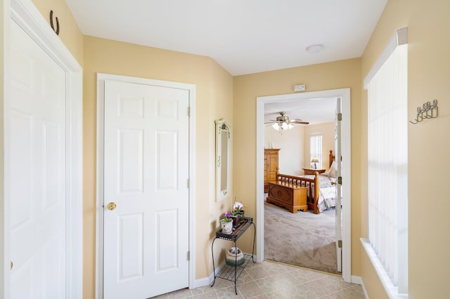 9050 Hartley Rd, Hallsville, MO 65255 - corridor featuring light colored carpet and light tile patterned floors