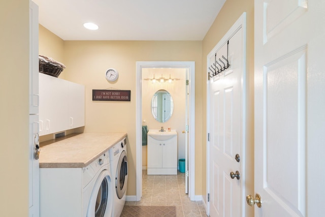 9050 Hartley Rd, Hallsville, MO 65255 - washroom with cabinet space, washing machine and clothes dryer, and light tile patterned floors