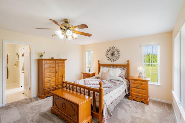 9050 Hartley Rd, Hallsville, MO 65255 - bedroom featuring light colored carpet, ensuite bathroom, and a ceiling fan