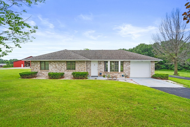 7275 N Route E, Columbia, MO 65202 - ranch-style house featuring concrete driveway, an attached garage, a front lawn, a shingled roof, and brick siding