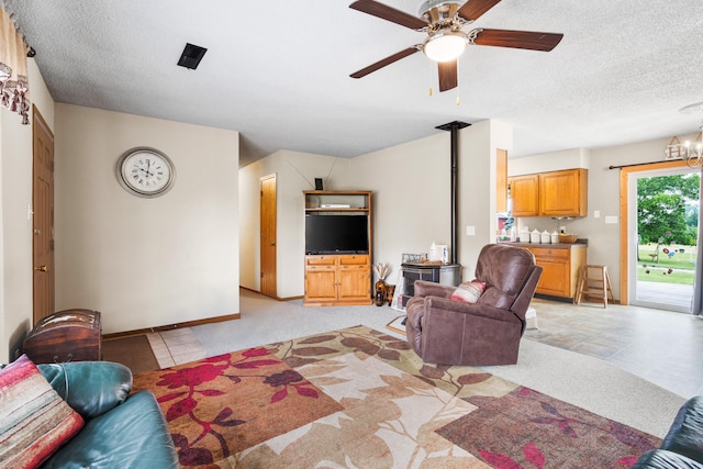7275 N Route E, Columbia, MO 65202 - living room featuring a ceiling fan, a textured ceiling, and light colored carpet