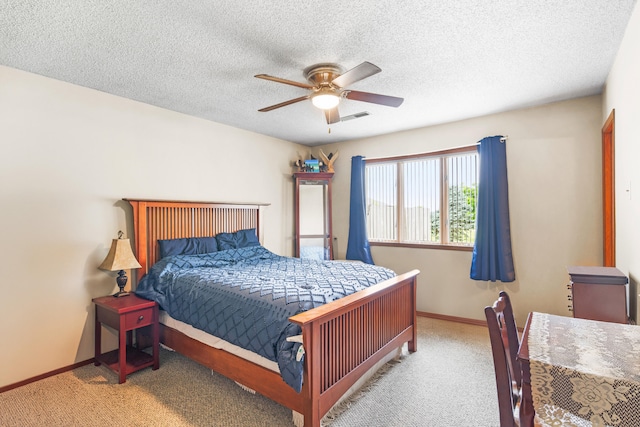 7275 N Route E, Columbia, MO 65202 - carpeted bedroom with ceiling fan and a textured ceiling