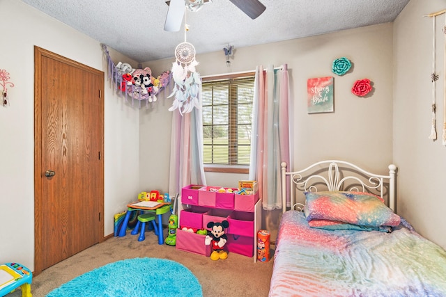 7275 N Route E, Columbia, MO 65202 - carpeted bedroom featuring ceiling fan, a textured ceiling, and a closet