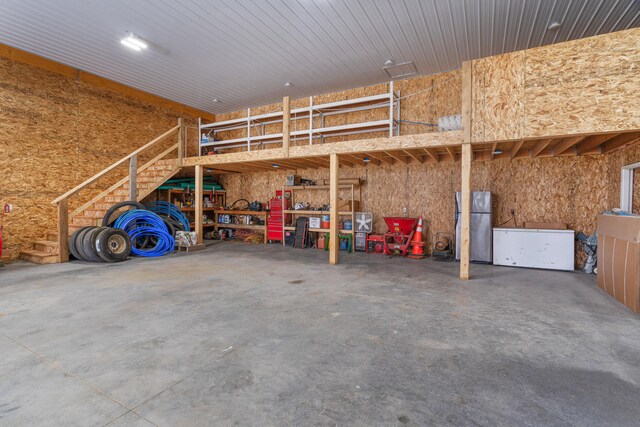 7275 N Route E, Columbia, MO 65202 - garage featuring freestanding refrigerator and fridge