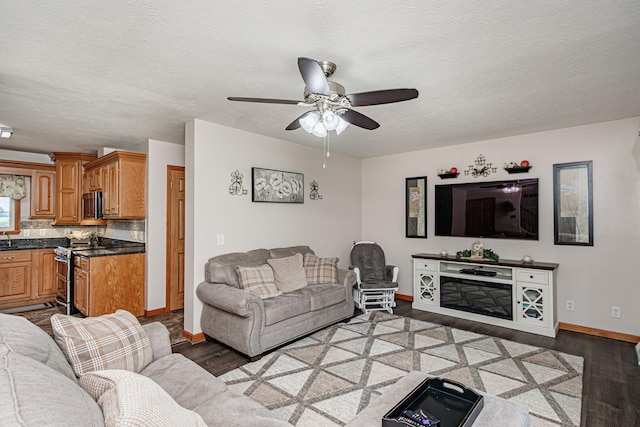 11100 E J B Ln, Hallsville, MO 65255 - living room featuring light wood-style floors, ceiling fan, and a textured ceiling