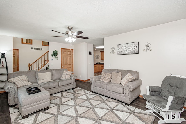 11100 E J B Ln, Hallsville, MO 65255 - living room featuring light wood-style floors, stairs, ceiling fan, and a textured ceiling