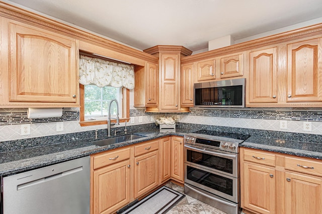 11100 E J B Ln, Hallsville, MO 65255 - kitchen featuring appliances with stainless steel finishes, dark stone counters, and light brown cabinets