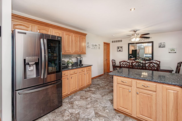11100 E J B Ln, Hallsville, MO 65255 - kitchen with stainless steel fridge with ice dispenser, ceiling fan, dark stone countertops, and backsplash