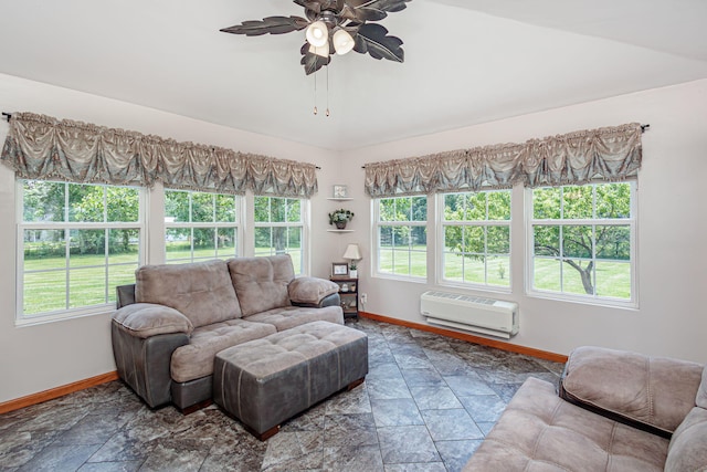 11100 E J B Ln, Hallsville, MO 65255 - living area with a wall mounted AC, a ceiling fan, and stone finish floors