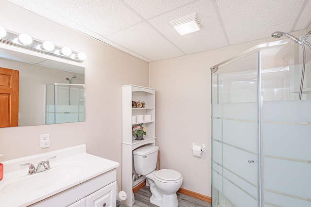 11100 E J B Ln, Hallsville, MO 65255 - bathroom featuring a drop ceiling, vanity, a stall shower, and wood finished floors