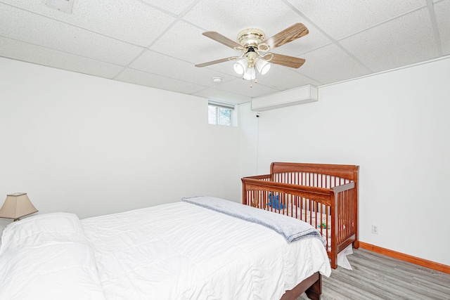 11100 E J B Ln, Hallsville, MO 65255 - bedroom with wood finished floors, a paneled ceiling, and a ceiling fan