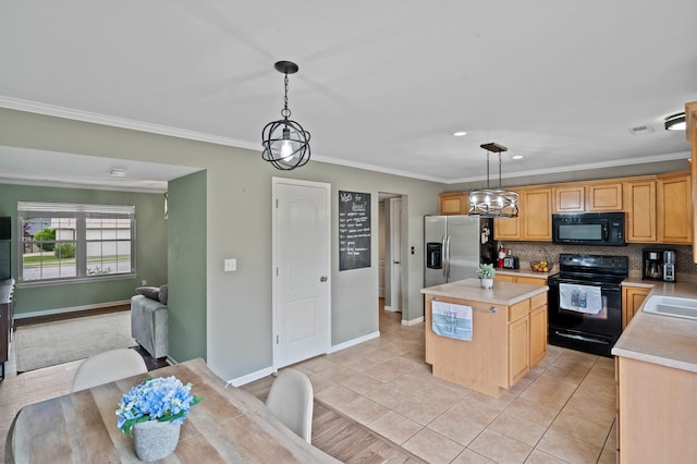 5010 Aspen Ridge Dr, Columbia, MO 65202 - kitchen with black appliances, light countertops, a kitchen island, decorative backsplash, and crown molding
